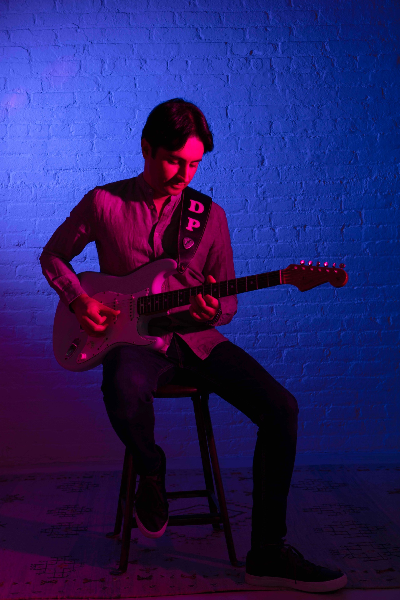 Davide Pannozzo playing guitar on stage